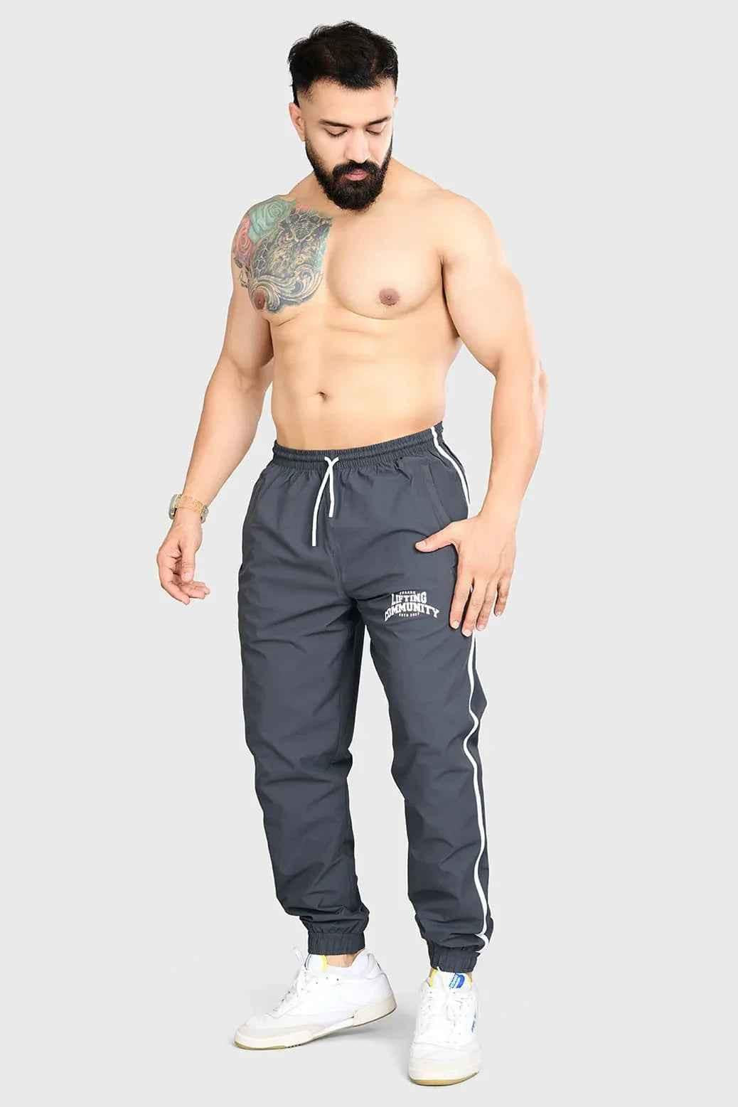 Fuaark Nz Lifting Community Joggers in coal, casual black joggers with elastic waistband and relaxed fit for comfortable wear.