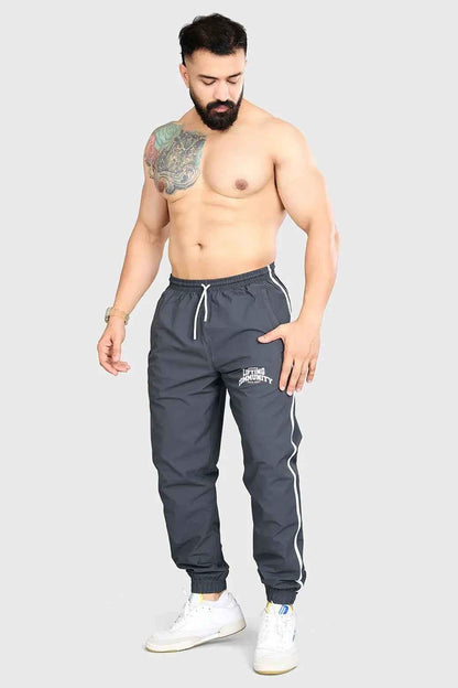Fuaark Nz Lifting Community Joggers in coal, casual black joggers with elastic waistband and relaxed fit for comfortable wear.