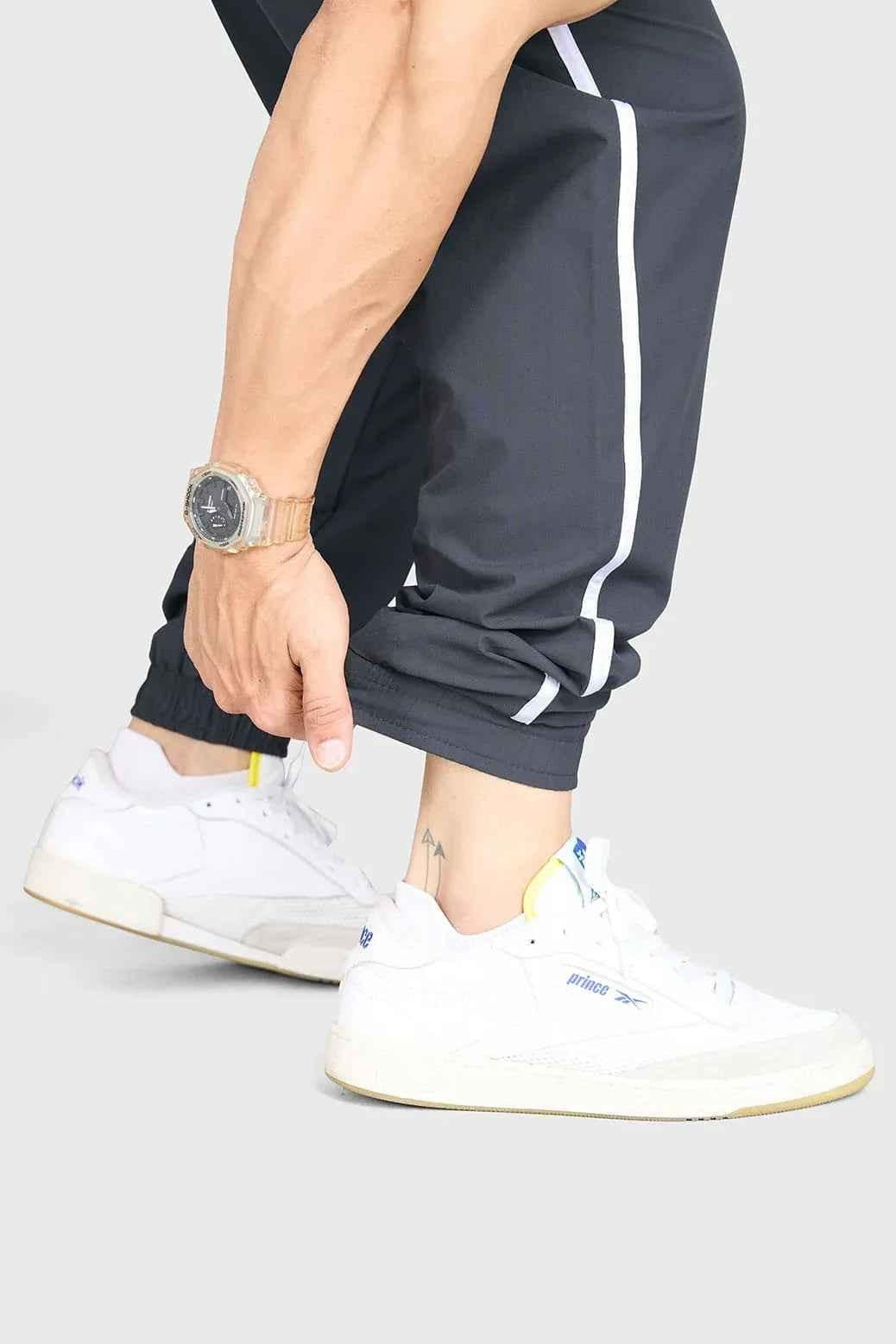 Fuaark Nz Lifting Community Joggers in coal color, slim-fit athletic joggers with drawstring waist and side pockets.