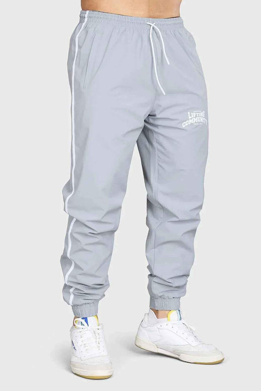 Light grey Fuaark Nz Lifting Community Joggers, comfortable fit, casual style, shown on a model.