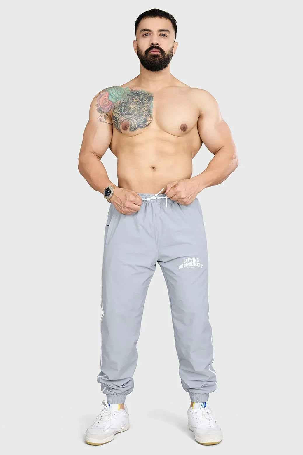 Light grey Fuaark Nz Lifting Community Joggers with comfortable fit and stylish design, shown on a model.