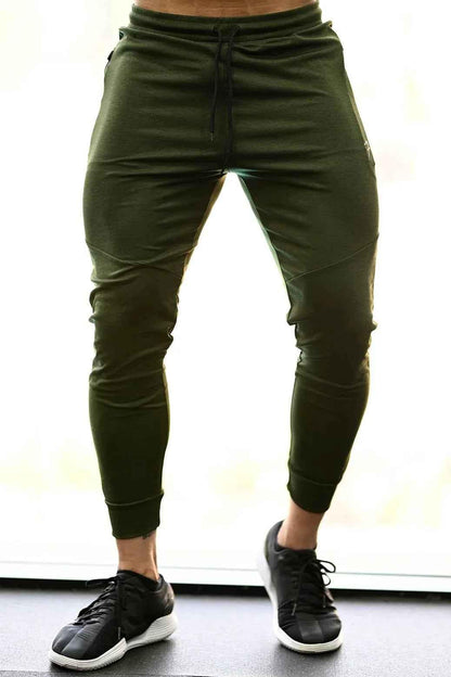 Fuaark Nz melange green joggers for men, featuring a comfortable fit and casual style, shown on a model.