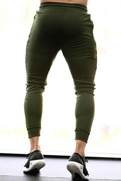 Fuaark Nz melange green joggers for men, soft fabric, comfortable fit, casual style, shown on a model.