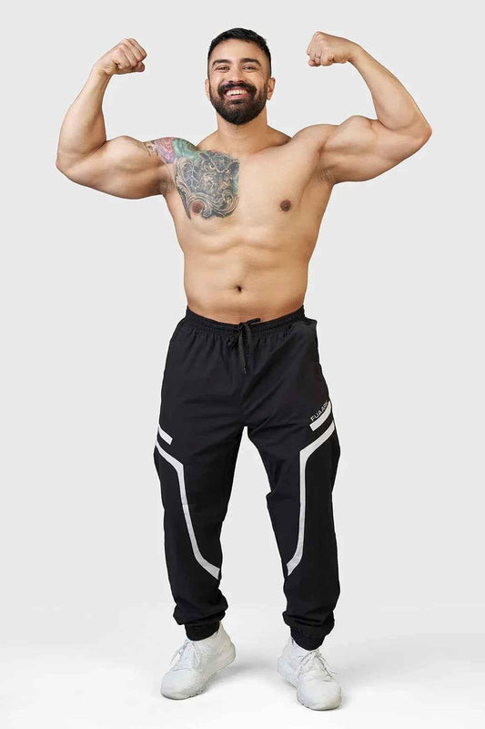 Black Fuaark Nz Momentum Joggers displayed on a model, showcasing a comfortable fit and casual style.