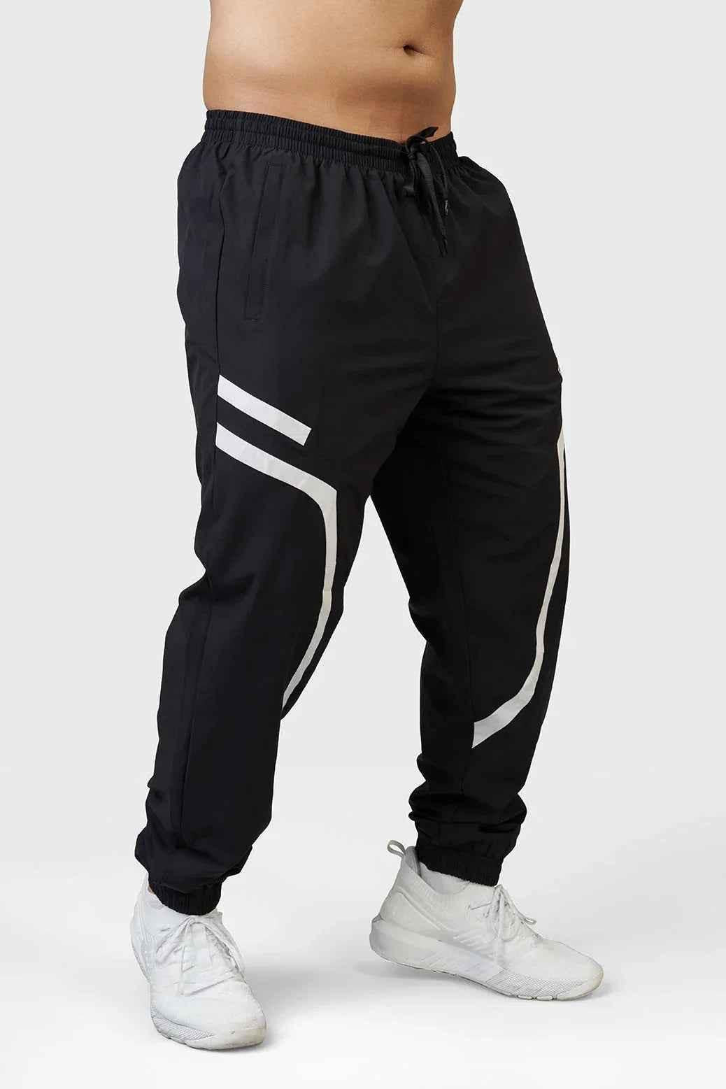 Black Fuaark Nz Momentum Joggers, casual athletic pants with a relaxed fit and comfortable waistband, shown on a model.