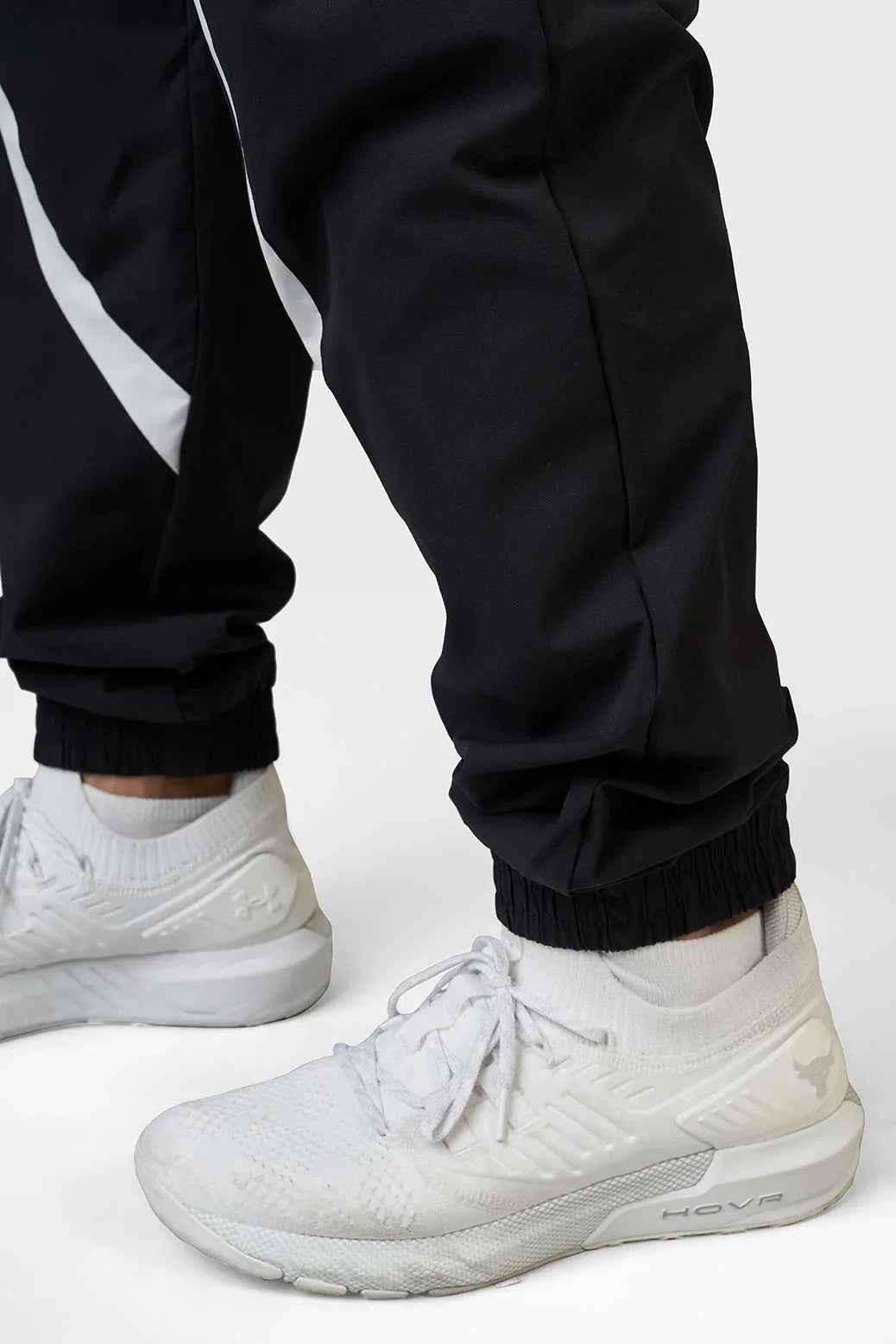 Black Fuaark Nz Momentum Joggers laid flat, showing the comfortable fit and sleek design of these casual athletic joggers.