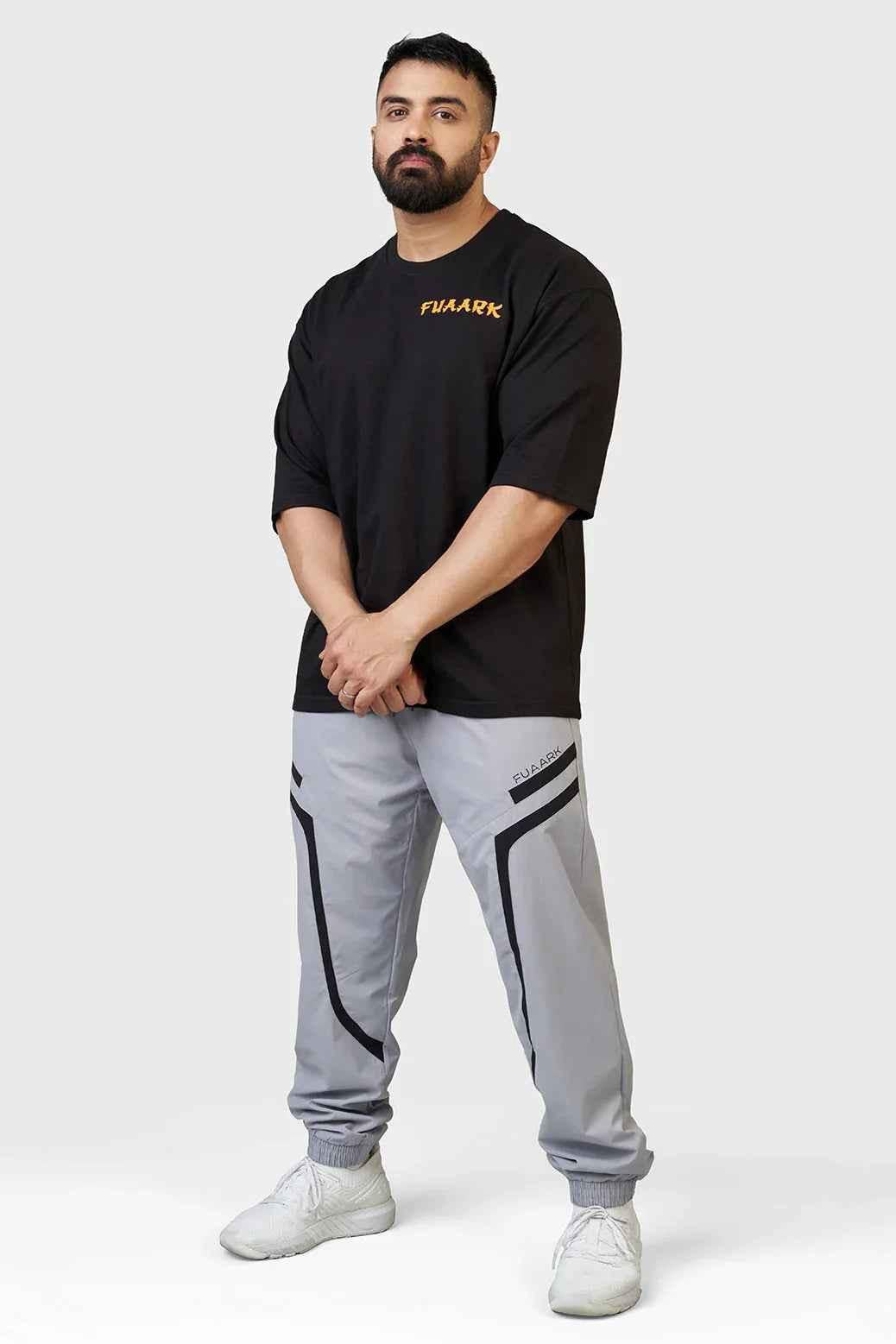 Light grey Fuaark Nz Momentum Joggers shown with adjustable waistband and tapered fit, comfortable casual wear for men.