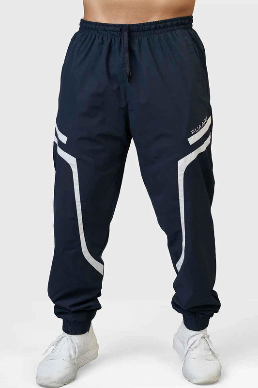 Fuaark Nz navy Momentum joggers featuring comfortable fit and stylish design, shown on a model.