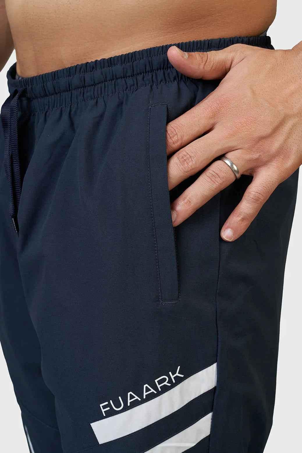 Fuaark NZ navy Momentum joggers laid flat, showing the comfortable fit and elastic waistband, perfect for casual wear.