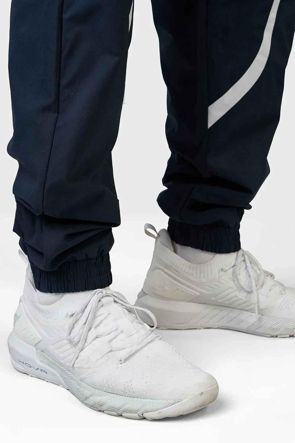 Fuaark Nz Momentum Navy Joggers displayed flat with elastic waistband, showcasing comfortable casual fit and navy color.