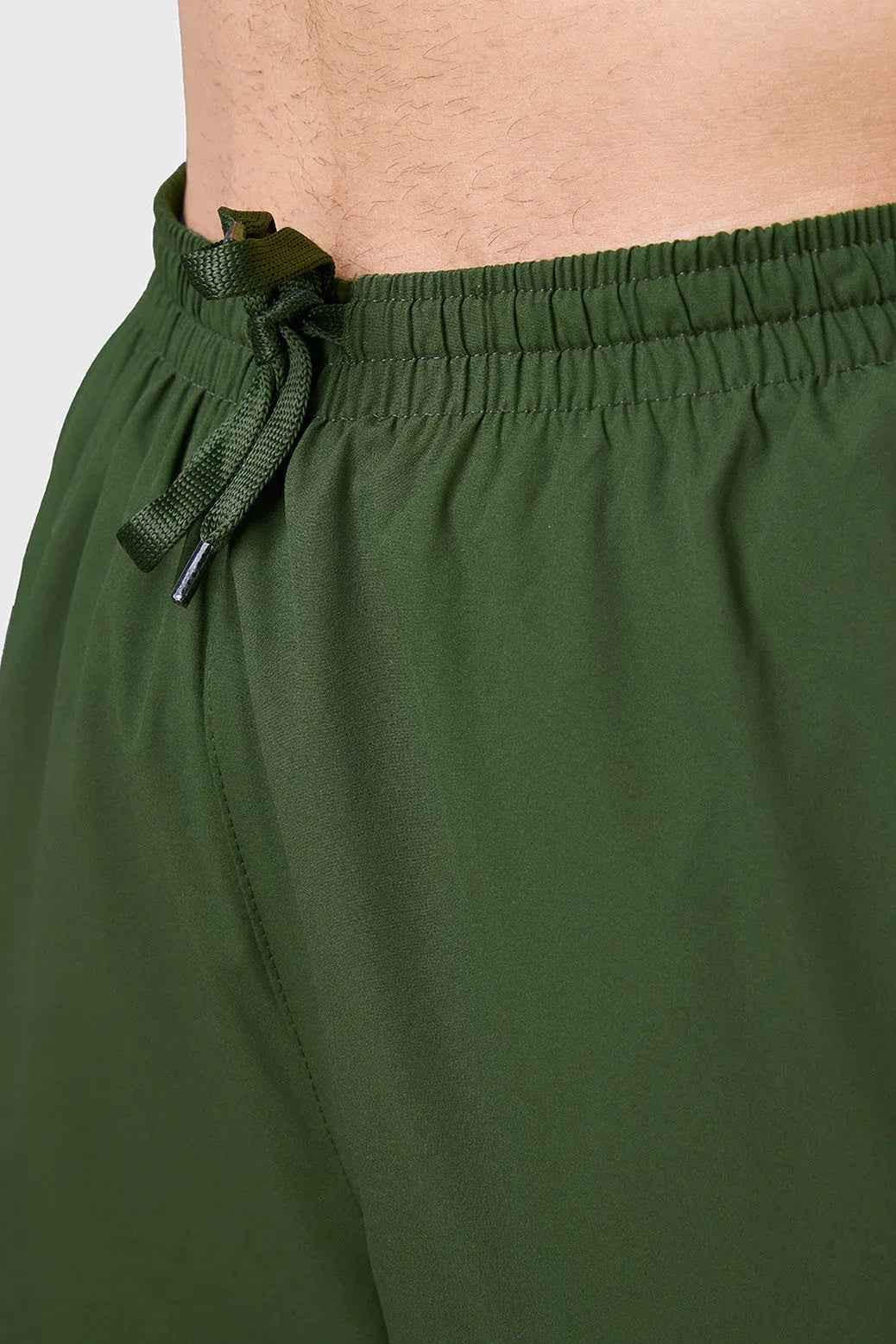 Fuaark Nz Momentum Joggers in olive color, casual athletic pants with a relaxed fit and adjustable waistband.