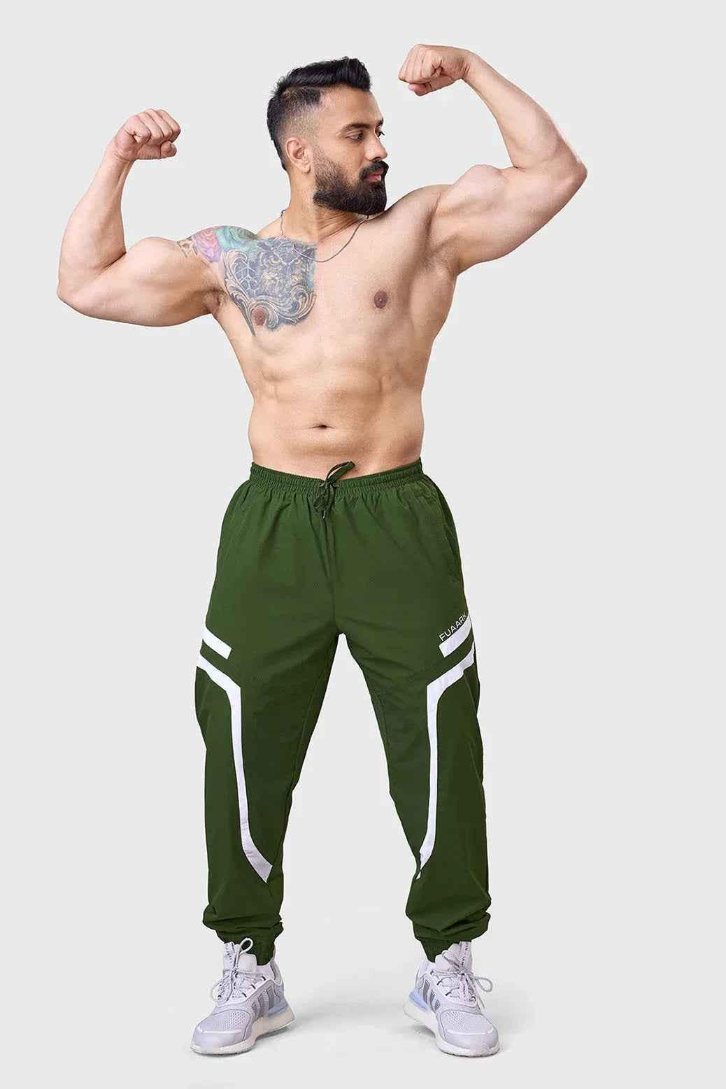 Fuaark Nz Momentum Joggers in olive color, casual fit with elastic waistband and cuffs, designed for comfort and style.