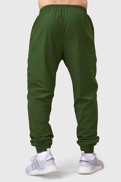 Fuaark Nz Momentum Joggers in olive color, casual athletic pants with elastic waistband and tapered fit, displayed on a plain background.