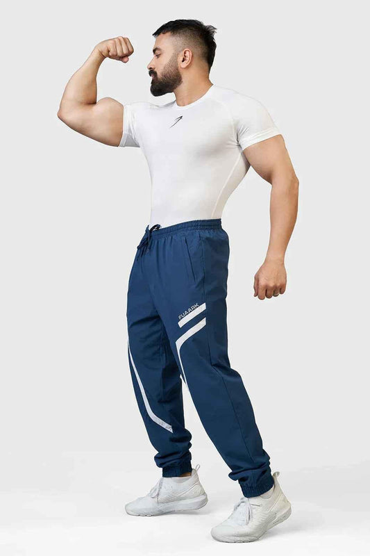 Fuaark Nz Momentum Joggers in teal, showing relaxed fit and elastic waistband, made from soft, comfortable fabric.