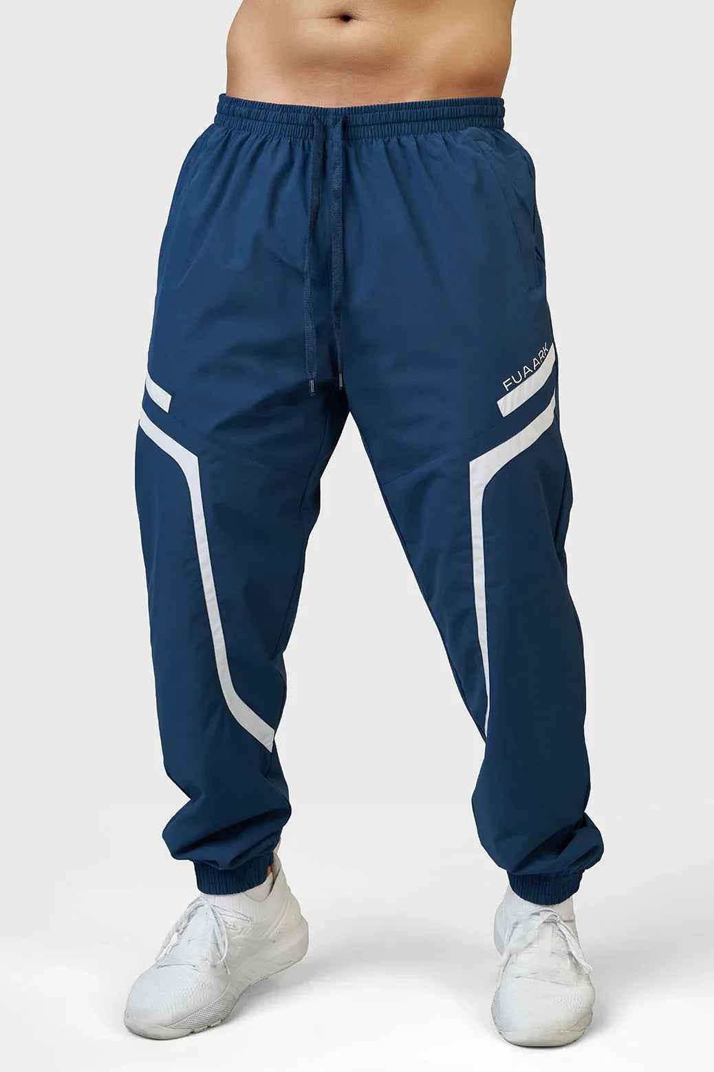 Fuaark Nz Momentum Joggers in Teal, shown on a model, featuring a comfortable fit and stylish design for casual wear.
