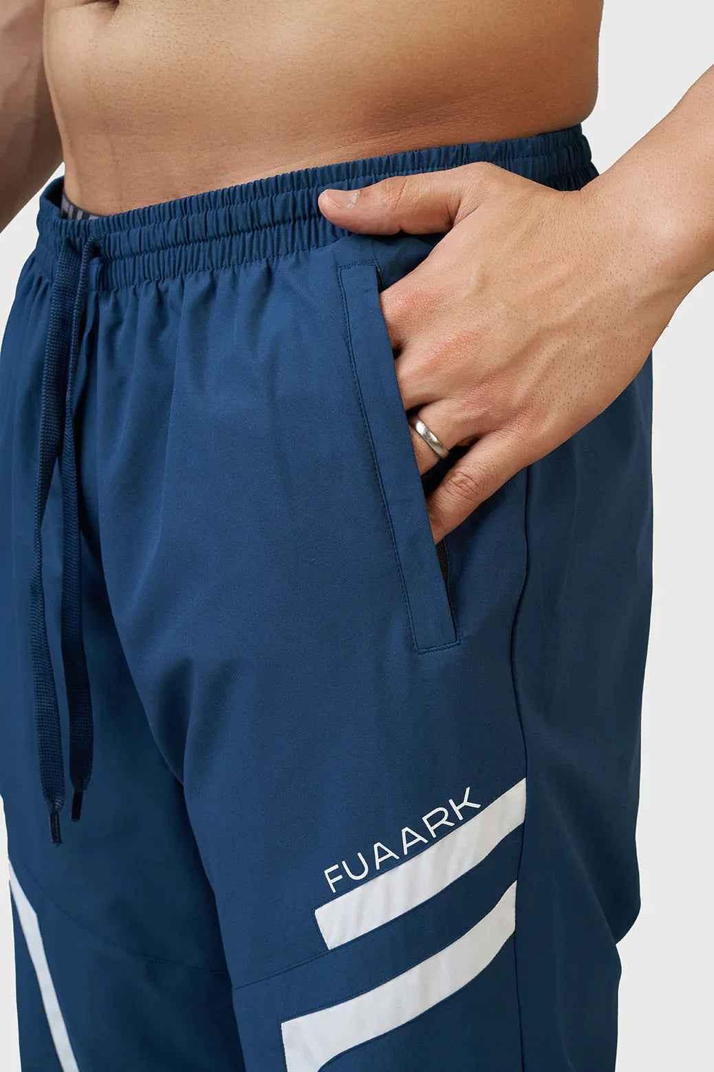 Fuaark Nz Momentum Joggers in teal color, casual athletic pants with a relaxed fit and elastic waistband, front view.
