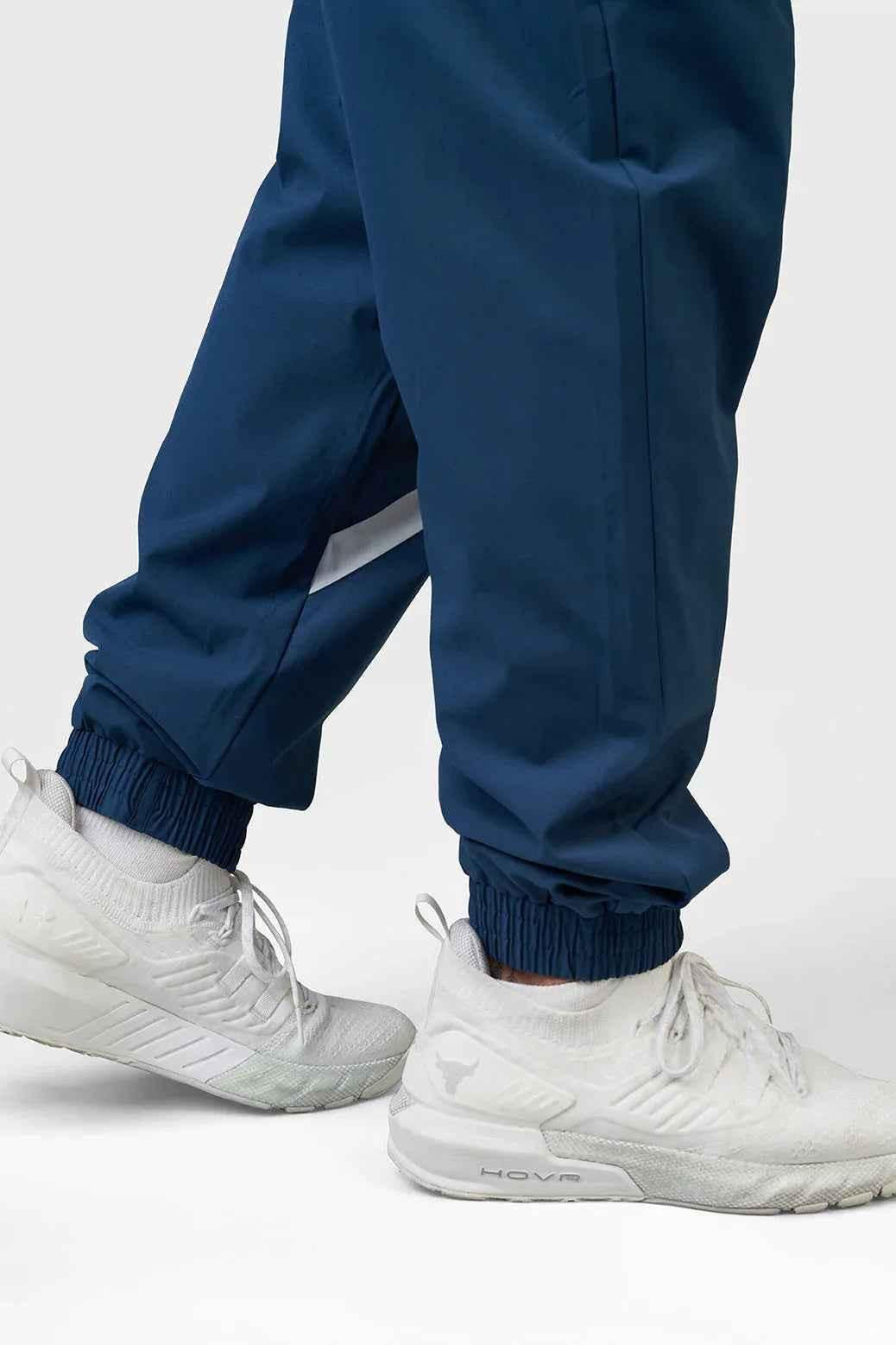 Fuaark Nz Momentum Joggers in teal color, casual athletic pants with an elastic waistband and tapered fit.