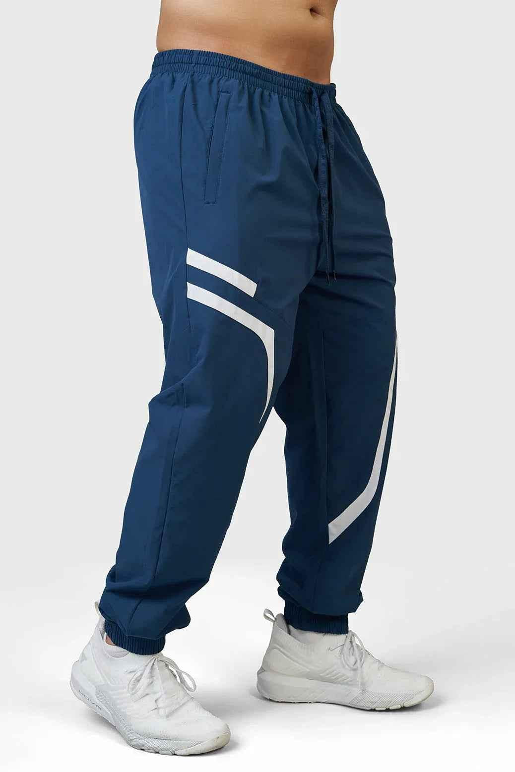 Fuaark Nz Momentum Joggers in teal color, made from comfortable fabric, with a relaxed fit and elastic waistband.