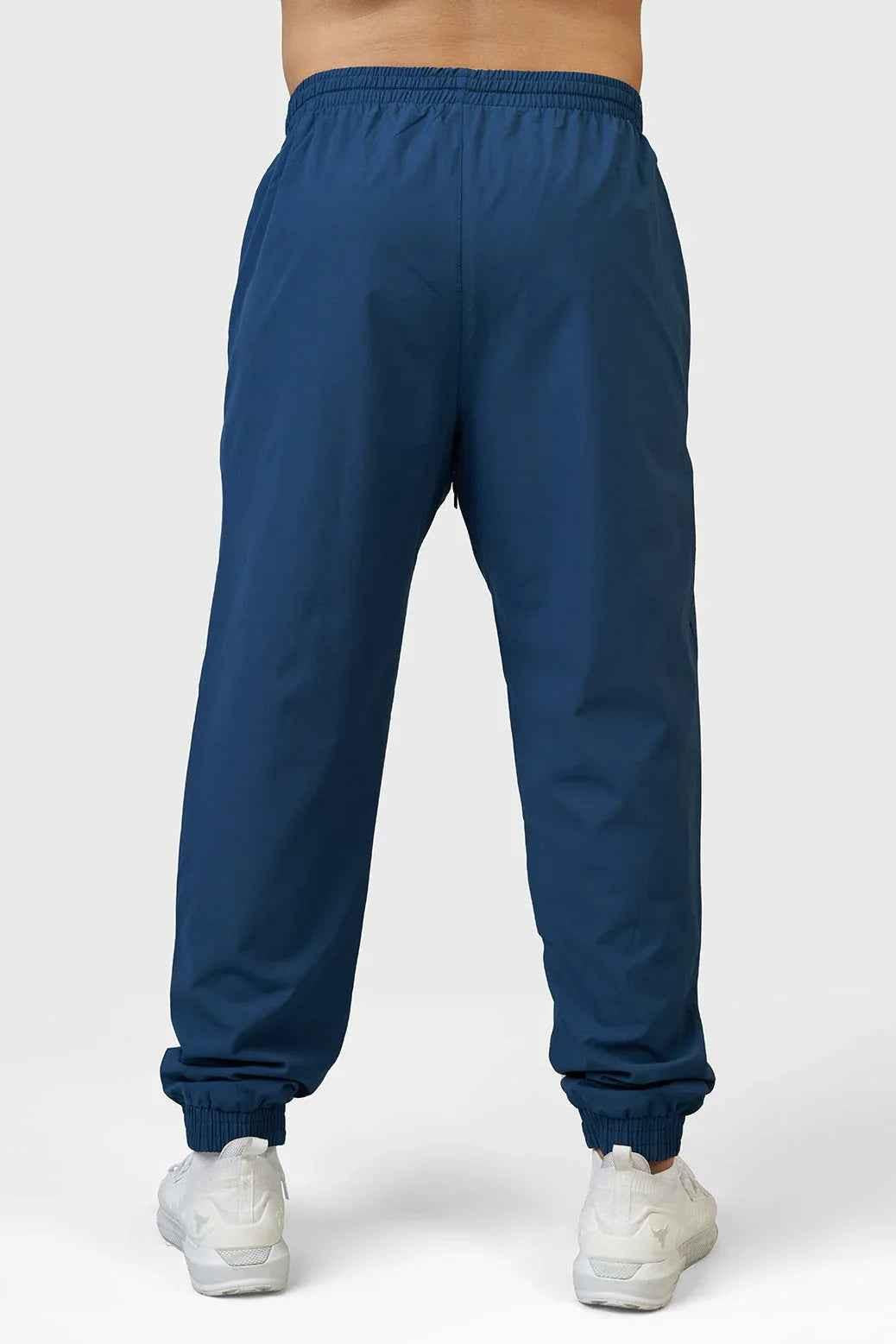 Fuaark Nz Momentum Joggers in teal color, featuring a comfortable fit and stylish design, shown on a model.