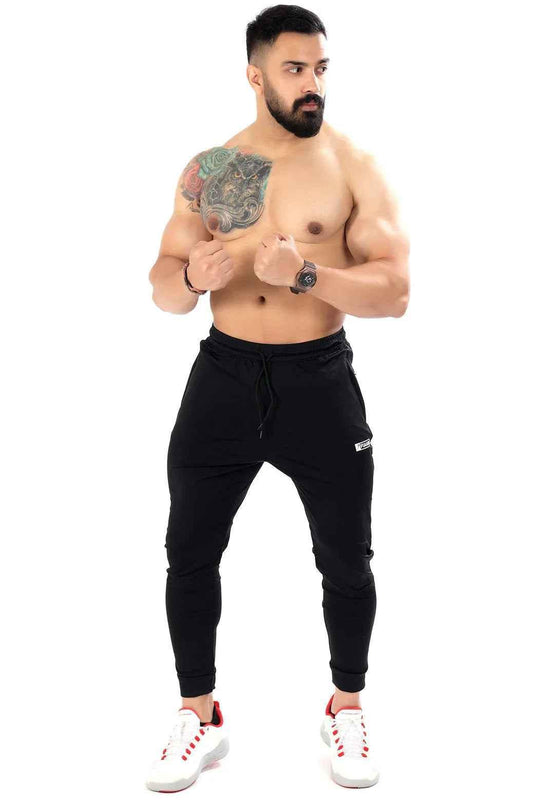 Black nylon joggers by Fuaark Nz featuring a sleek design for comfortable, stylish casual wear.