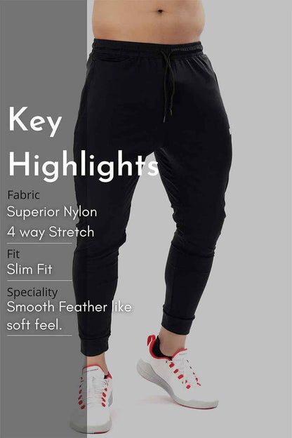 Black nylon joggers by Fuaark Nz, showcasing a comfortable fit and stylish design with a sleek, modern look.