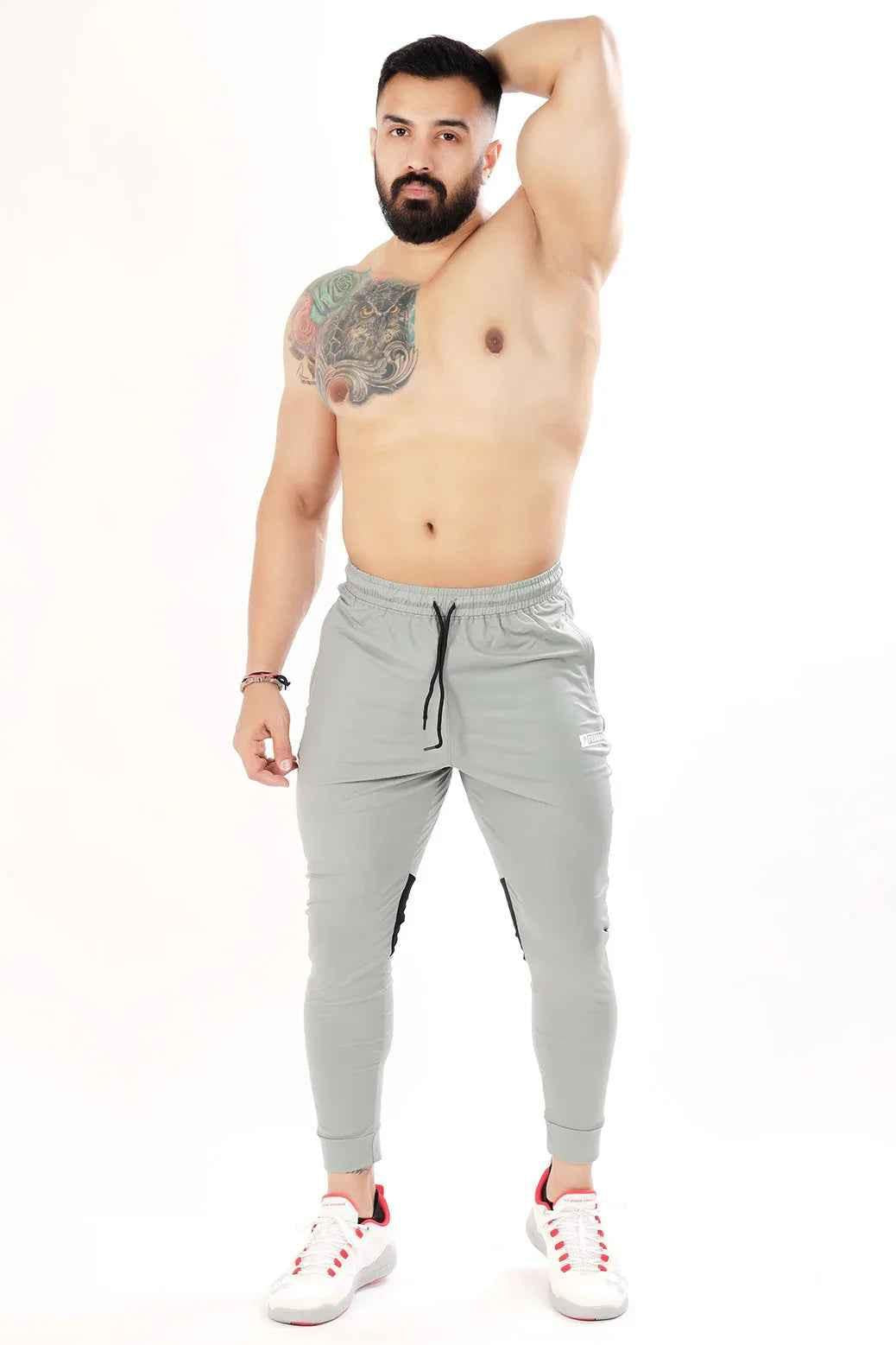 Light grey nylon joggers by Fuaark Nz featuring a comfortable fit and stylish design, perfect for casual wear.
