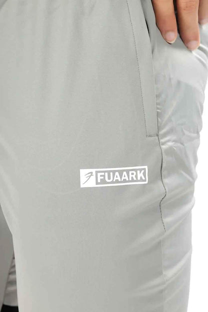 Light grey nylon joggers by Fuaark Nz, showcasing comfortable fit and stylish design perfect for casual wear.