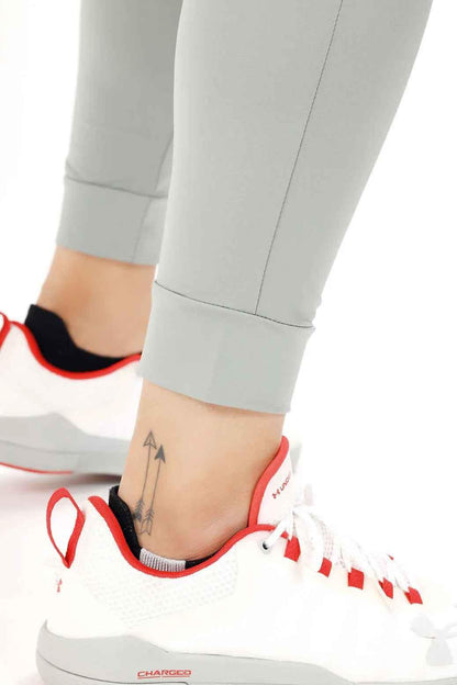 Light grey nylon joggers by Fuaark Nz featuring a relaxed fit and comfortable style for casual wear.