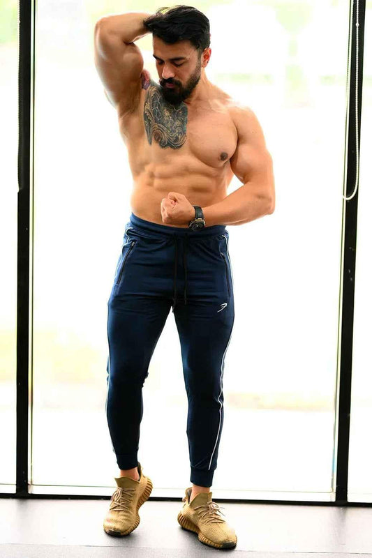 Fuaark Nz Revival men's blue joggers, stylish and comfortable activewear with a relaxed fit and modern design.