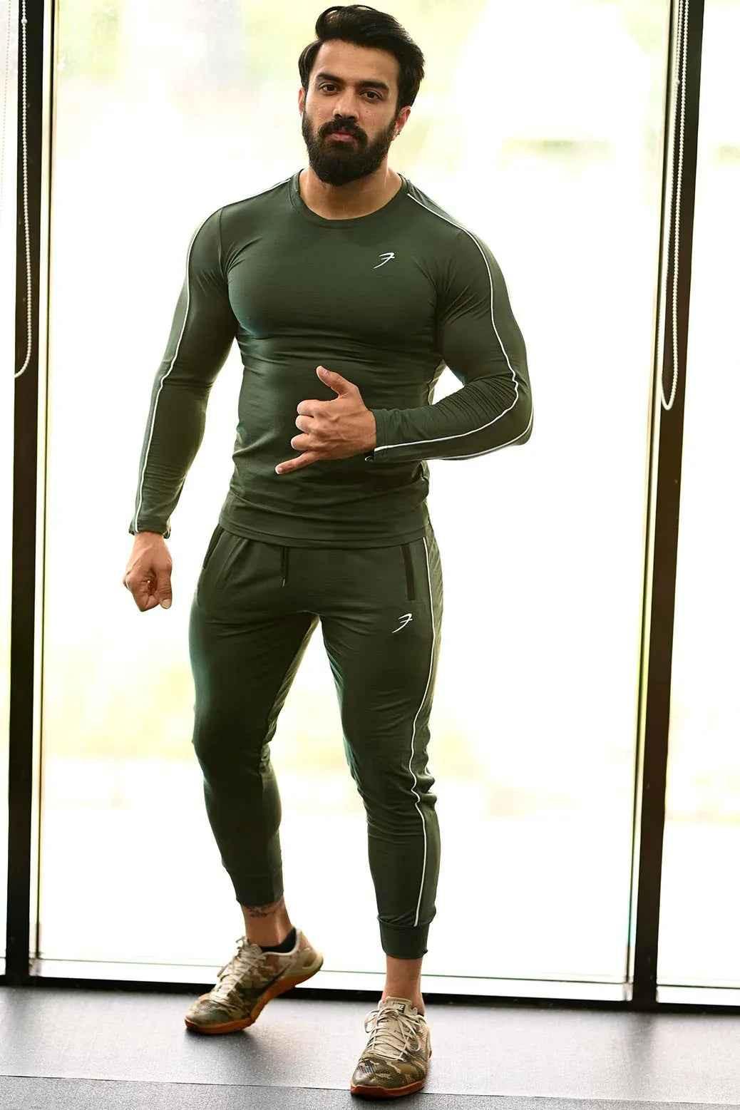 Green Revival Joggers by Fuaark Nz shown on a model, featuring a comfortable fit and casual style.