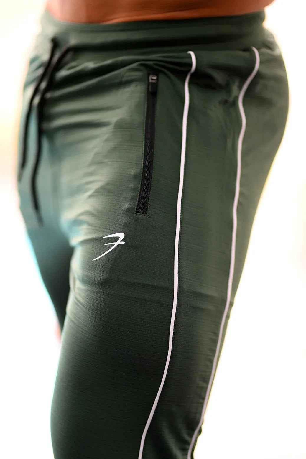 Green Revival Joggers by Fuaark Nz, made of comfortable fabric, shown on a model with a relaxed fit and modern style.