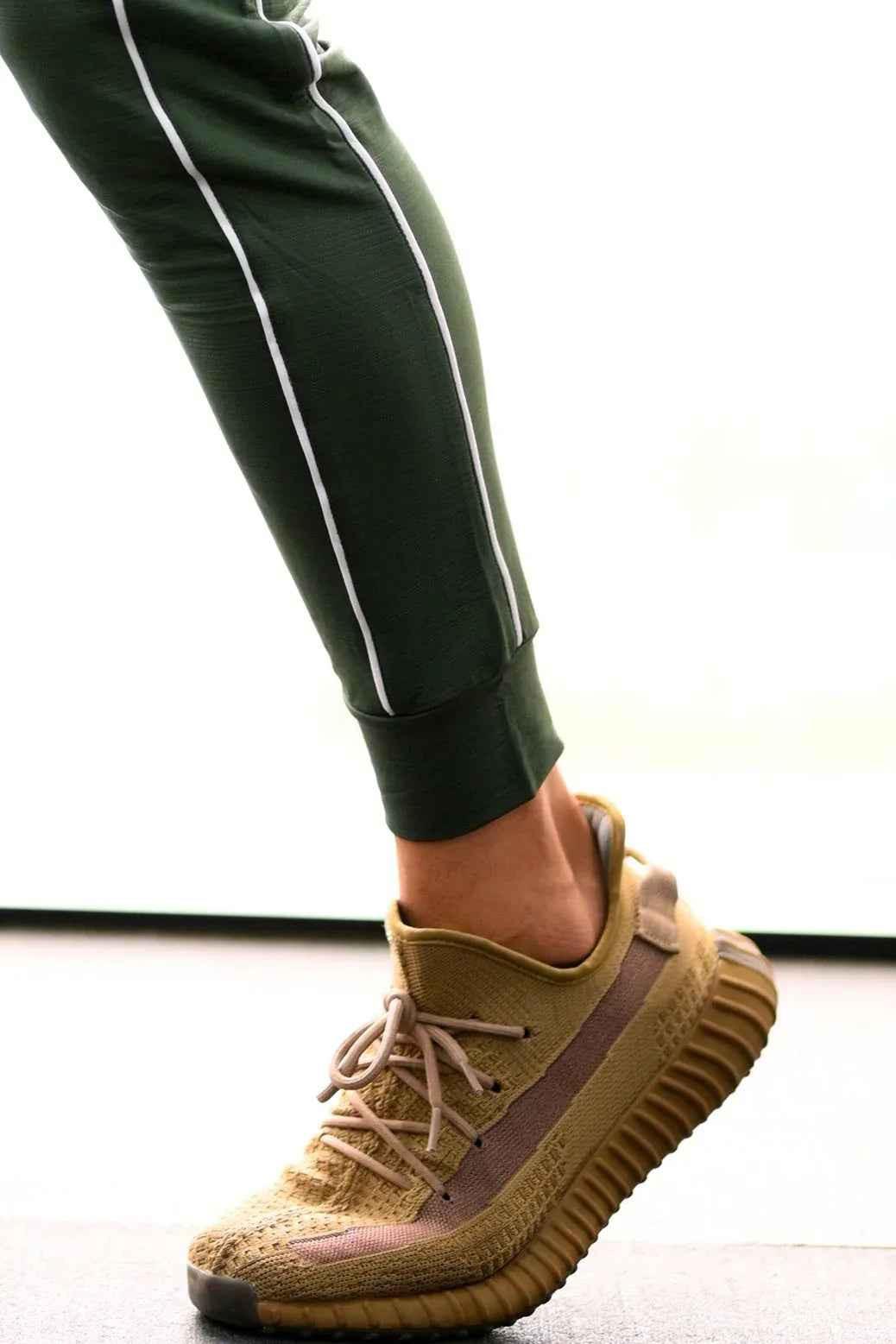 Green Revival Joggers by Fuaark Nz, featuring a comfortable fit and stylish design, shown on a model.