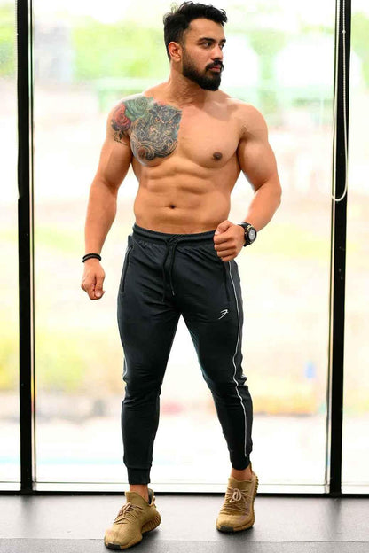 Steel grey Fuaark Nz Revival Joggers, casual fit with elastic waistband and pockets, shown on a model.