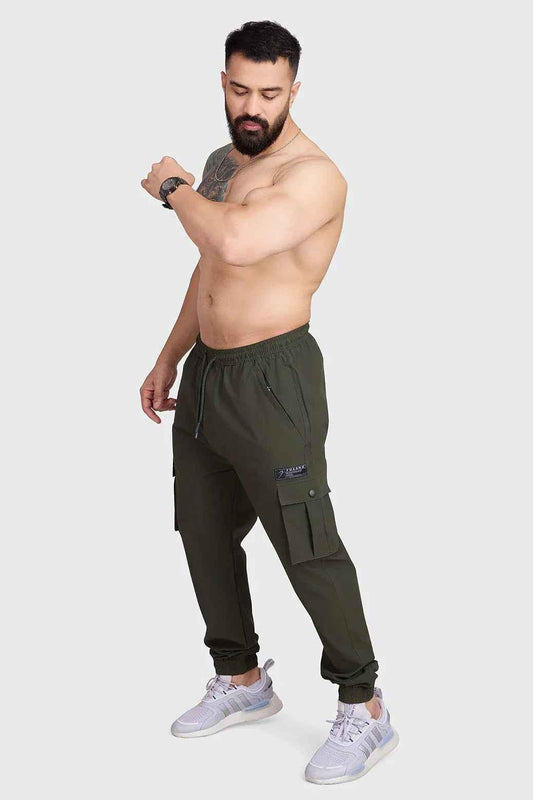 Fuaark Nz Army Script Cargo Joggers featuring multiple pockets, comfortable fit, and military-inspired design, shown in dark green fabric.