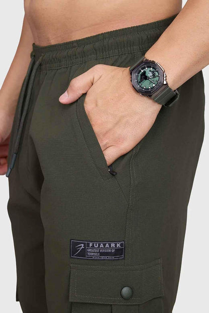 Fuaark Nz army script cargo joggers in olive green with multiple pockets and relaxed fit, casual streetwear style.