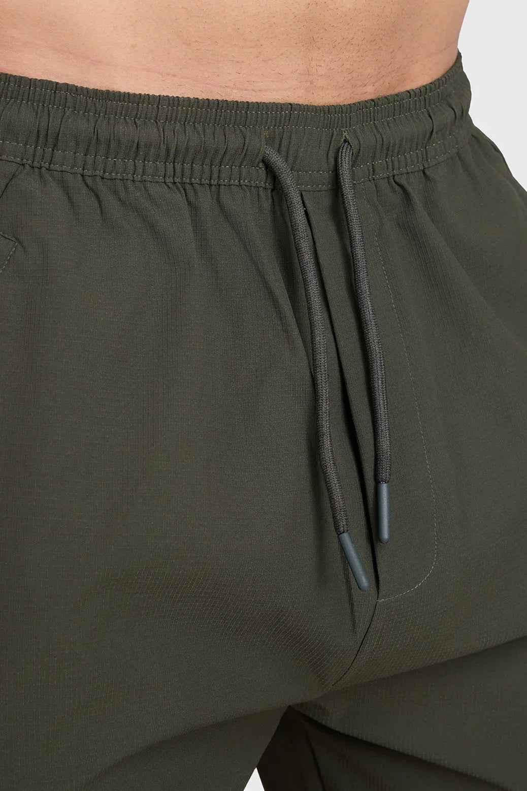 Fuaark Nz army script cargo joggers in green, featuring multiple pockets and comfortable fit, casual streetwear style.
