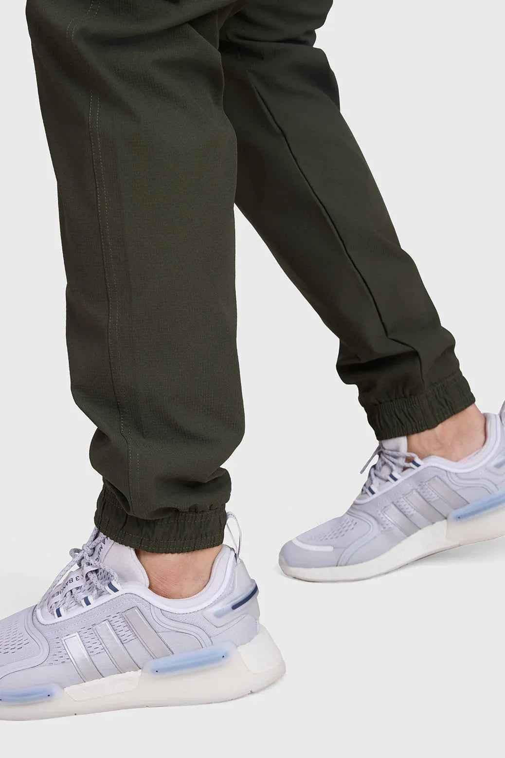 Fuaark Nz Script Cargo Joggers in Army green with multiple pockets and relaxed fit, designed for casual and comfortable wear.