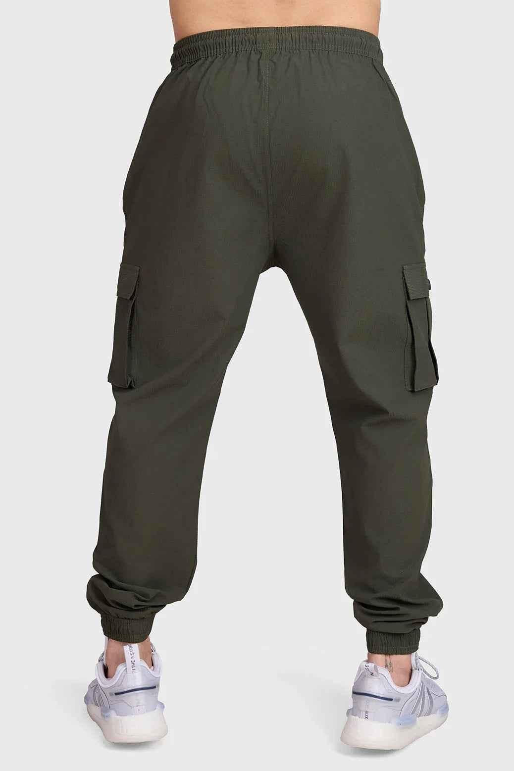 Fuaark Nz army script cargo joggers in green, featuring multiple pockets and a relaxed fit, suitable for casual wear.