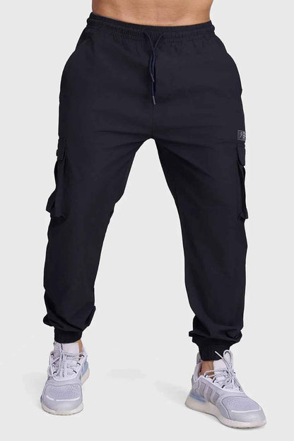 Black Fuaark Nz Script Cargo Joggers with multiple pockets and relaxed fit, made from comfortable fabric.