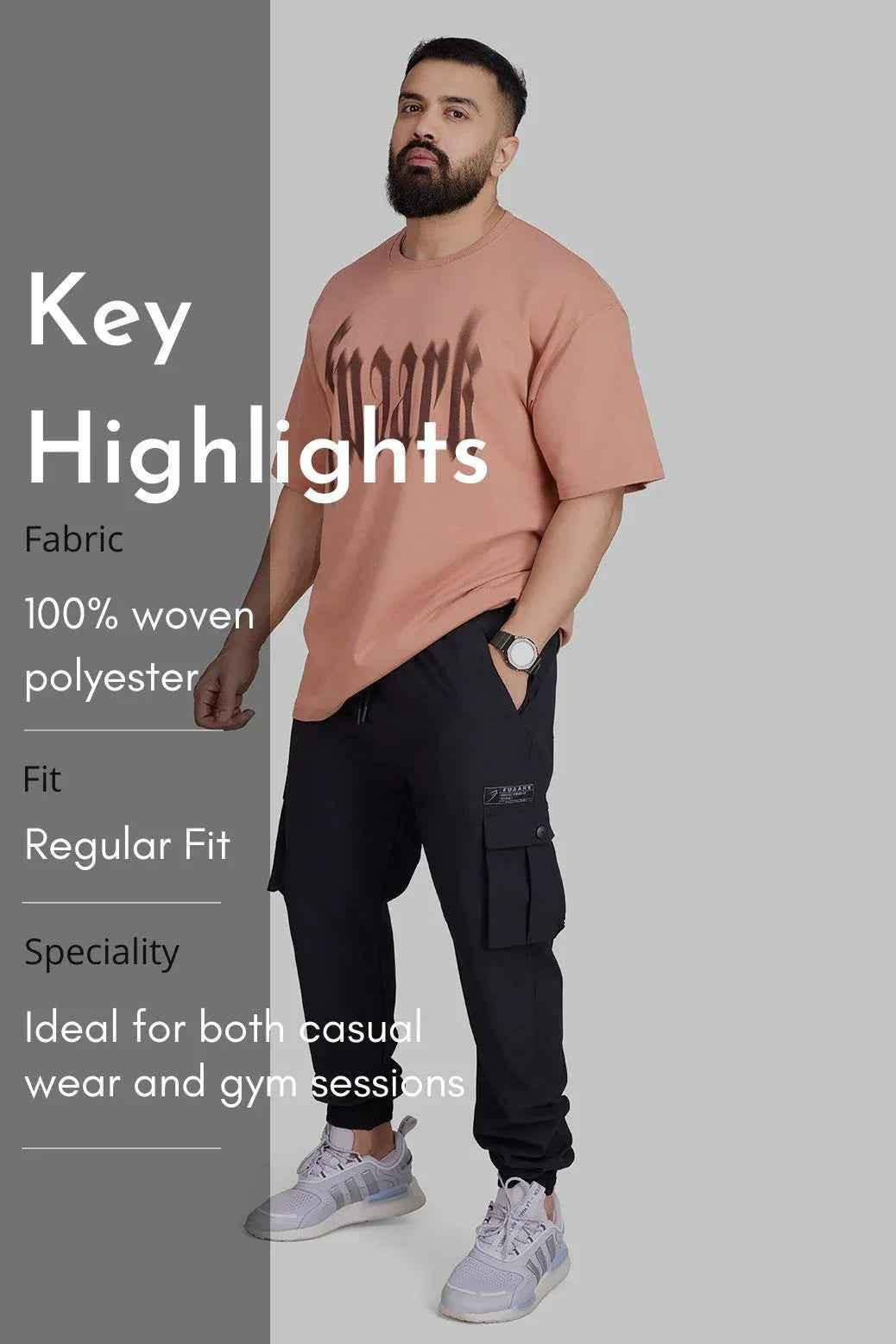 Black Script Cargo Joggers by Fuaark Nz featuring a relaxed fit, multiple cargo pockets, and comfortable jogger style.