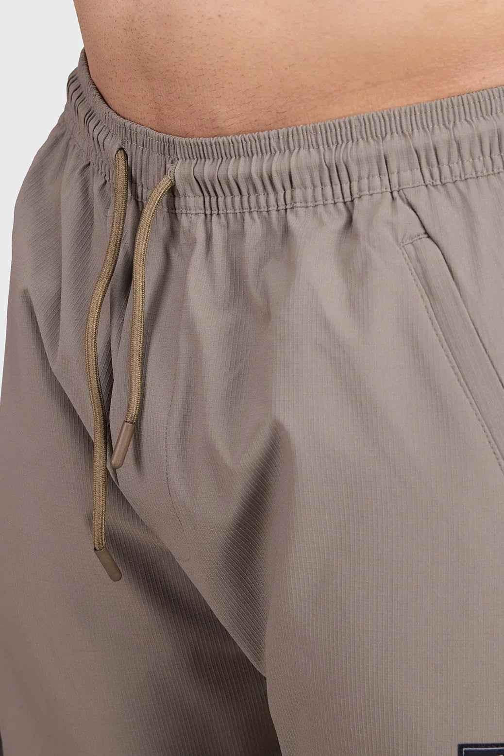 Brown Script Cargo Joggers by Fuaark Nz showing relaxed fit, cargo pockets, and comfortable fabric in a casual style.