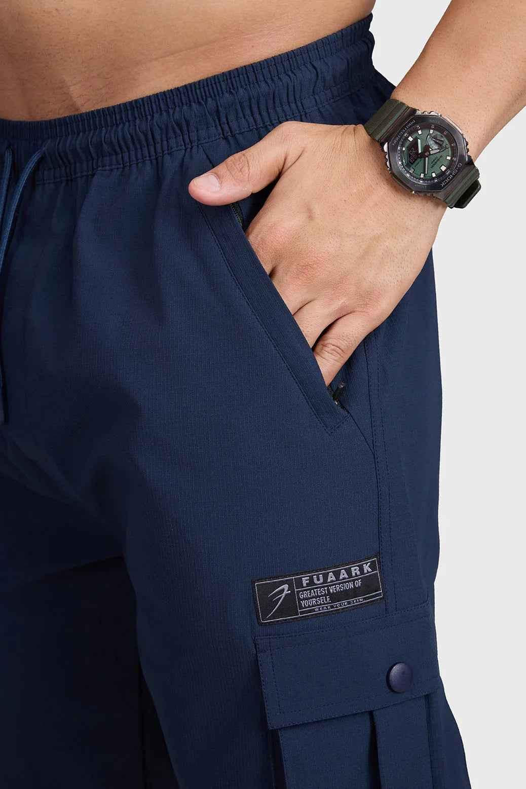 Dark navy Script Cargo Joggers by Fuaark Nz, featuring relaxed fit and multiple cargo pockets, made from comfortable fabric.