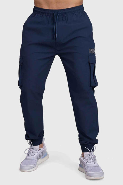 Dark navy Fuaark Nz Script Cargo Joggers, slim fit and comfortable casual pants with cargo pockets shown in the image.