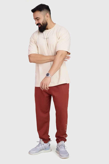 Fuaark Nz Signature Oversized Band Rust Joggers, stylish relaxed fit with bold band detail, casual and comfortable for everyday wear.