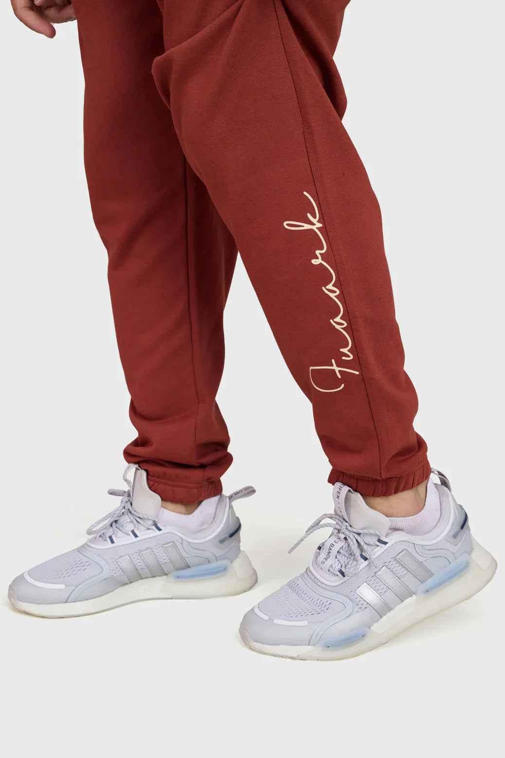 Rust-colored Fuaark Nz Signature Oversized Band Joggers, soft and stylish casual joggers with a relaxed fit and bold band detail.