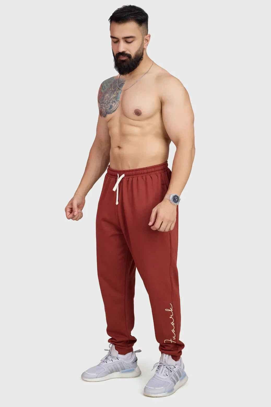 Rust-colored Fuaark Nz Signature Oversized Band Joggers with relaxed fit and elastic waistband, casual and stylish for everyday wear.