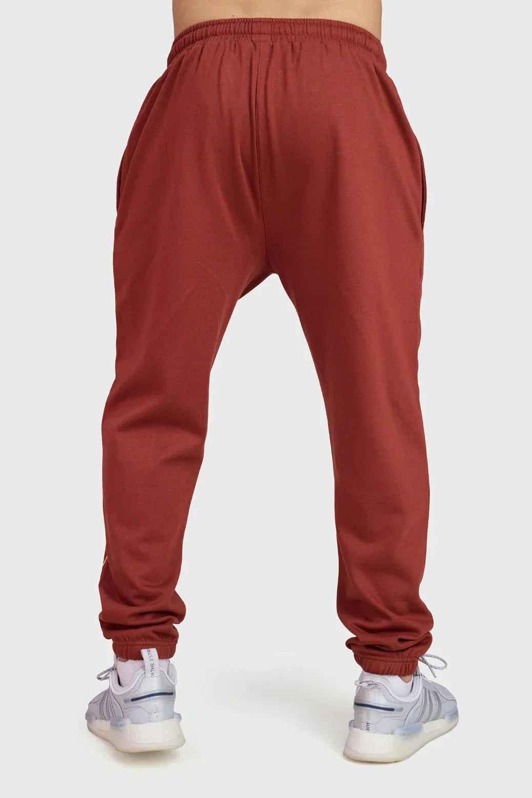 Rust-colored Fuaark Nz Signature Oversized Band Joggers, casual fit with bold band detail, made from comfortable jogger fabric.