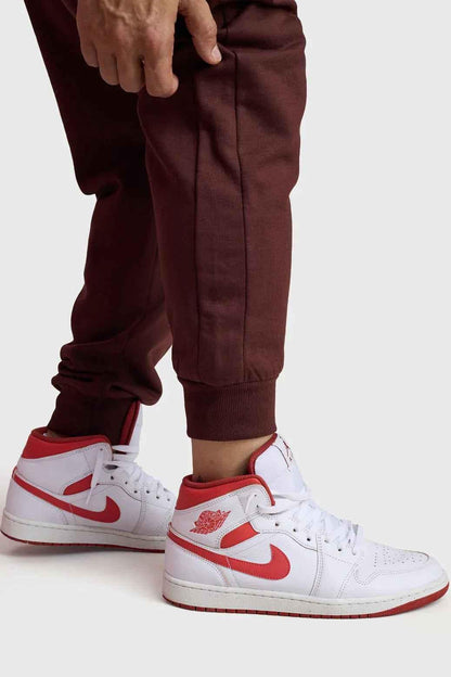 Fuaark Nz Signature Oversized Brown Joggers made of soft fabric, featuring a relaxed fit and casual style for comfortable wear.
