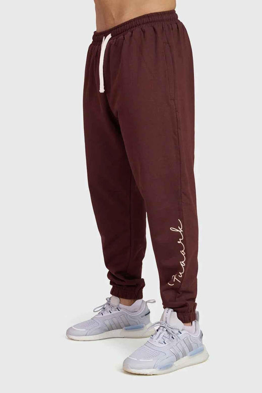 Fuaark Nz Signature oversized brown joggers made of soft fabric, featuring a relaxed fit and stylish design for ultimate comfort.