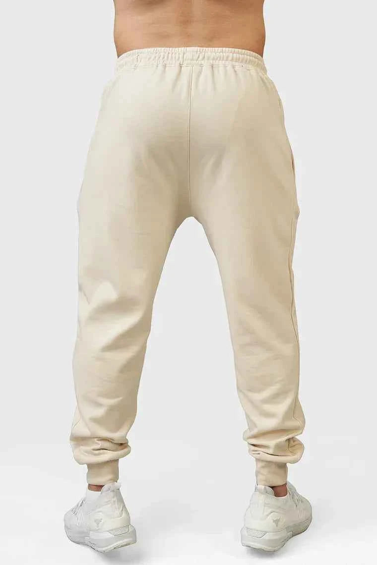 Fuaark Nz beige Signature Oversized Joggers laid flat, showing soft fabric and relaxed fit for casual comfort.